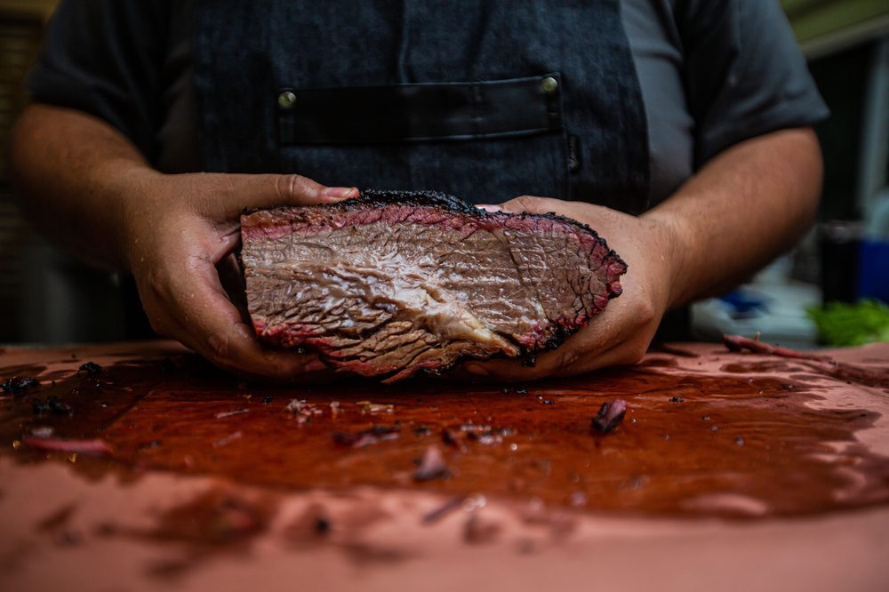 Chef hand-crafting a patty in the BKING kitchen